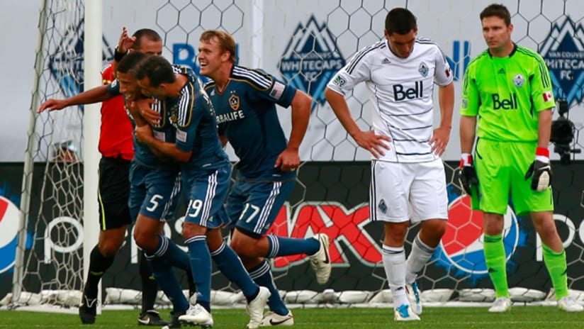 The LA Galaxy celebrate a goal against Vancouver.
