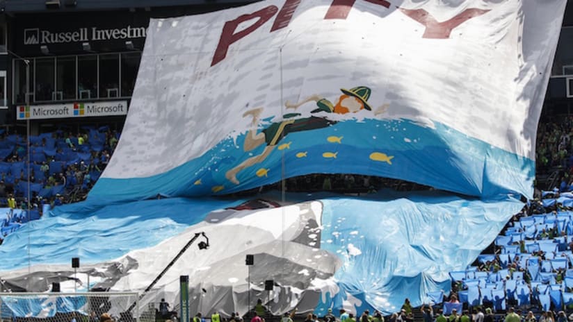 Seattle Sounders supporters unveil a tifo in a Heineken Rivalry Week game against Portland Timbers