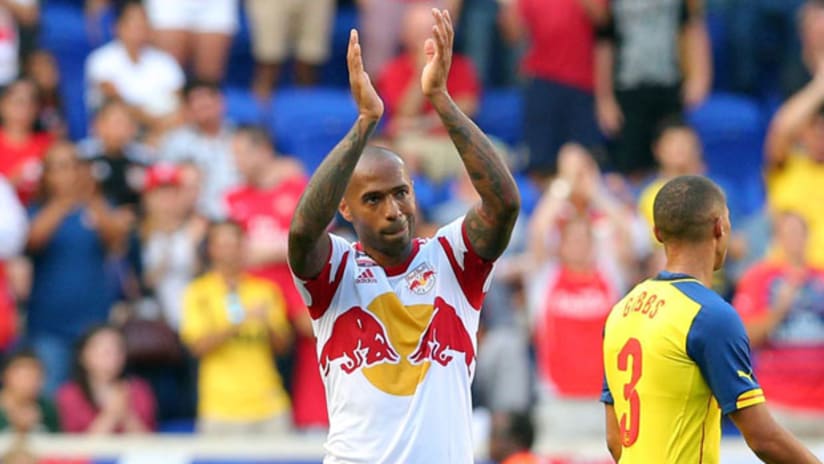 Thierry Henry applauds fans after match vs. Arsenal