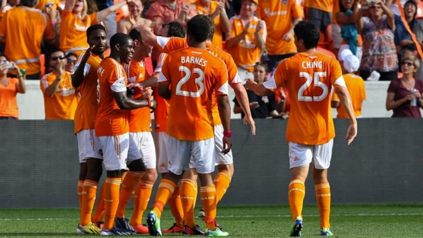The Houston Dynamo celebrate their winning goal against the Chicago Fire