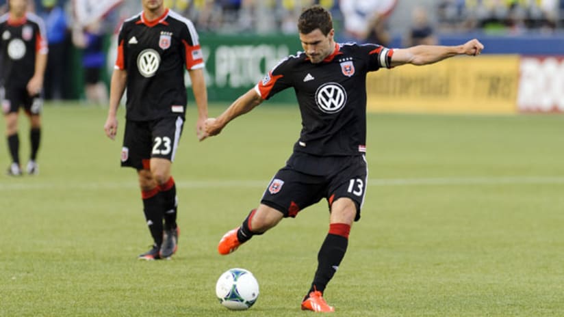 DC United's Chris Pontius takes a kick with a soccer ball