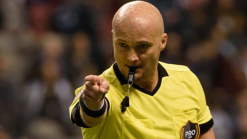 Referee Robert Sibiga - pointing with card