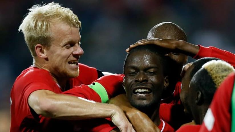 Canada celebrate a goal by Tosaint Ricketts