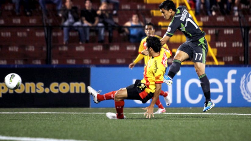 Sounders forward Fredy Montero scores against Herediano in CCL play.