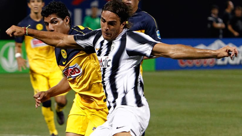 Juventus' Alessandro Matri (right) looks to get off a shot in front of America's Erik Pimentel.
