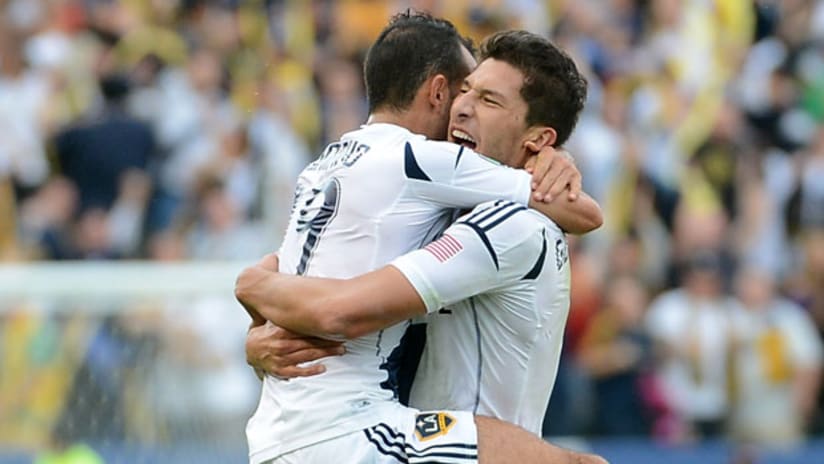 Omar Gonzales and Juninho of the LA Galaxy share a moment after Gonzalez's goal in the MLS Cup
