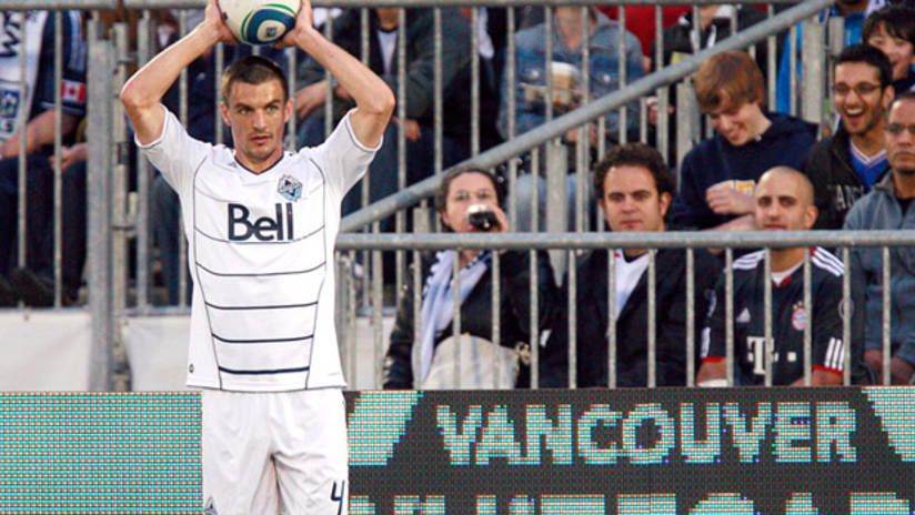 Vancouver's Alain Rochat takes a throw-in.