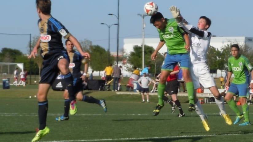 Seattle academy goalkeeper Sten Tolgu defends a corner kick at the Generation adidas Cup