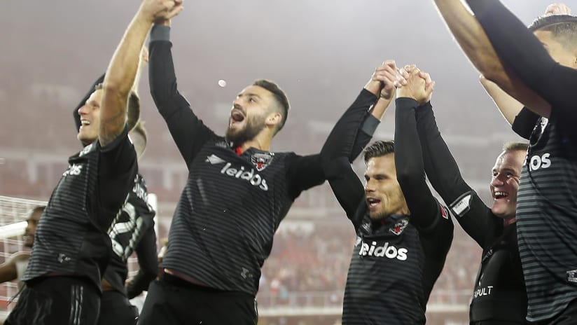 DC United - celebrate win with arms up
