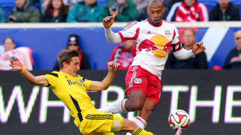 Ethan Finlay tackles Thierry Henry