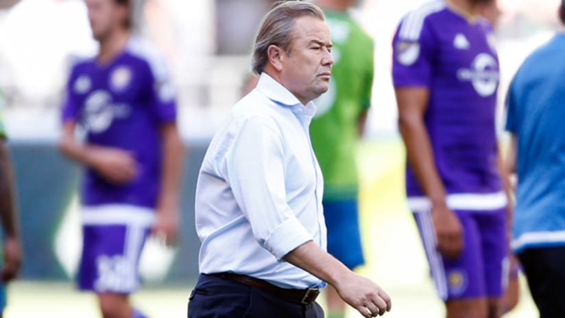 Orlando City SC coach Adrian Heath walks on the field after a 4-0 loss to Seattle