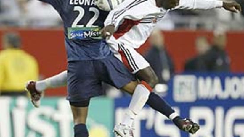 Freddy Adu (right) and Marshall Leonard battle for control of the ball.