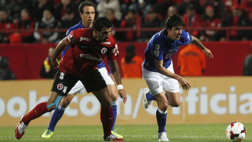 Cristian Pellerano of Tijuana and Mauro Formica of Cruz Azul in CCL play