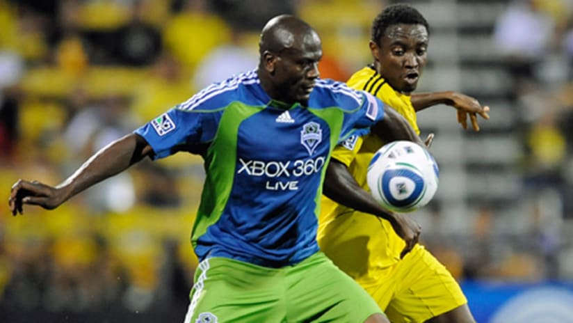 Blaise Nkufo overpowers Emmanuel Ekpo in Seattle's 4-0 rout of Columbus.