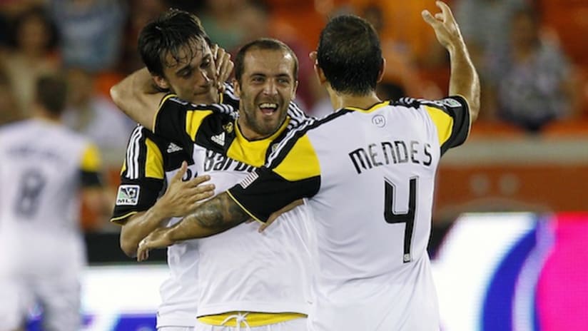 Federico Higuain celebrates with Crew teammates