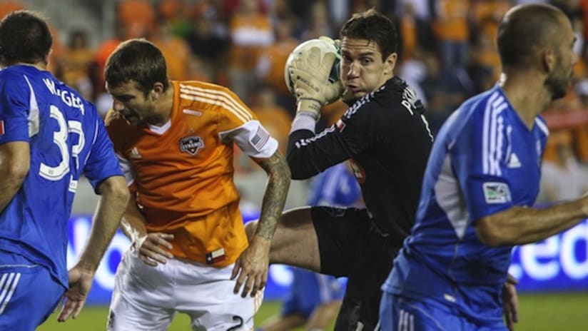 Troy Perkins collects a ball in Montreal's Knockout Round game against Houston