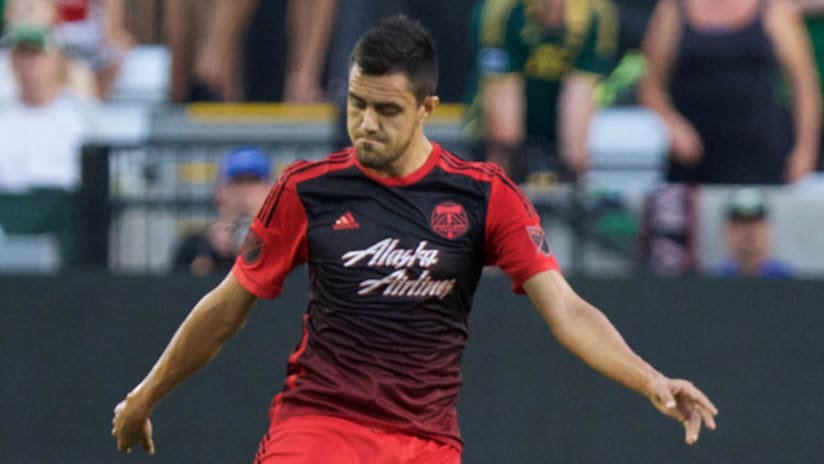 Portland Timbers defender Norberto Paparatto looks down to kick the ball