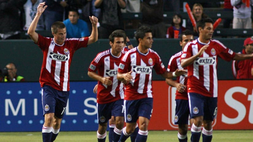 Chivas USA's Justin Braun (far left) celebrates with his teammates after scoring the game-winning goal of a 1-0 win over D.C. United.