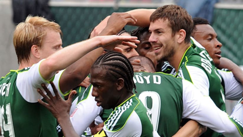 Members of the Portland Timbers celebrate a goal against the Chicago Fire on Sunday