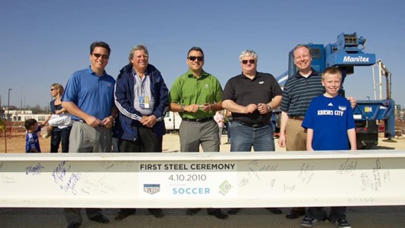 Wizards owners and the mayor of Kansas City, Kansas pose with the first steel beam