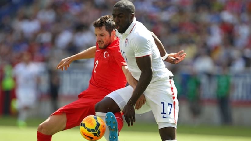 Jozy Altidore and a Turkish player battle for the ball