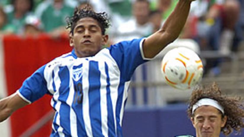 Carlos Costly (L) provided all the offense that Honduras would need to upset Mexico.