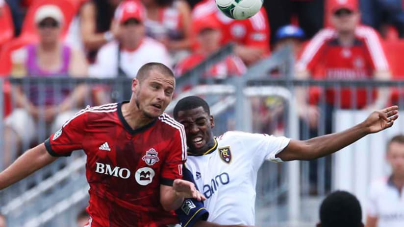 Danny Koevermans, Toronto FC, challenges RSL's Aaron Maund for a high ball.