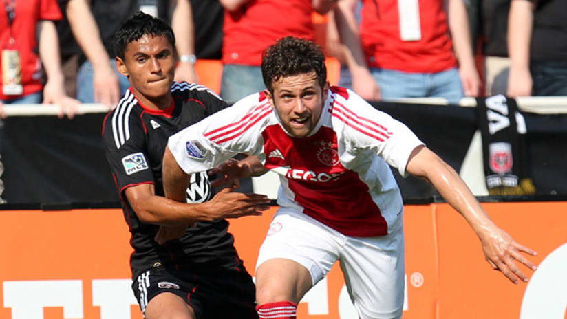 DC United's Andy Najar (left) looks to control Ajax's Miralem Sulejmani on Sunday at RFK Stadium.