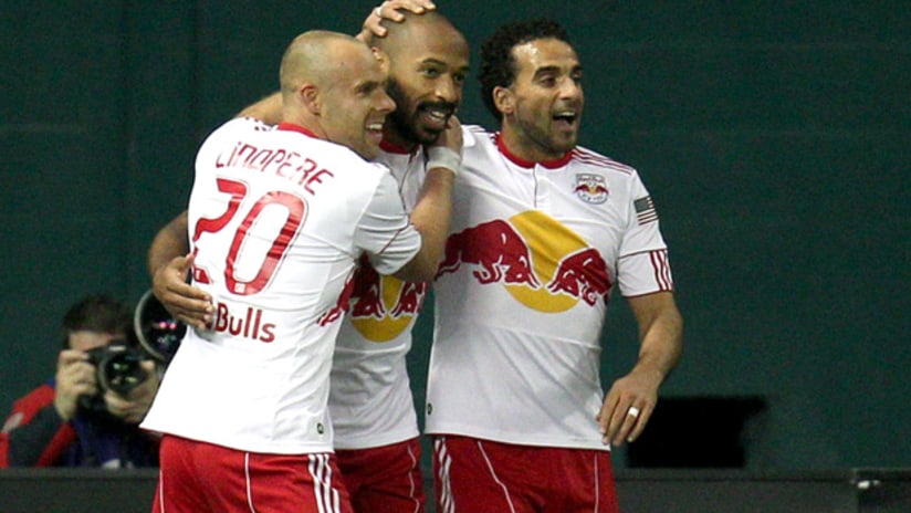 New York's Joel Lindpere and Dwayne De Rosario (right) celebrate Thierry Henry's goal vs. DC.