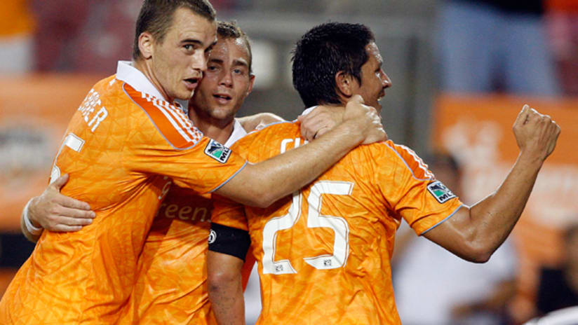 Brian Ching and the Dynamo celebrate a goal vs. Seattle.