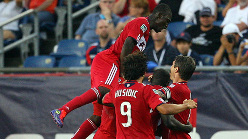 Dominic Oduro of the Chicago Fire is mobbed by his teammates following his goal.
