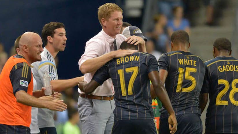 Brian Brown of the Philadelphia Union celebrates his first MLS goal with Jim Curtin
