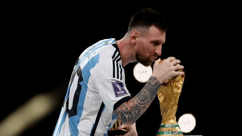 Argentina v France - Lusail Stadium, Lusail, Qatar - December 18, 2022 Argentina's Lionel Messi celebrates with the trophy
