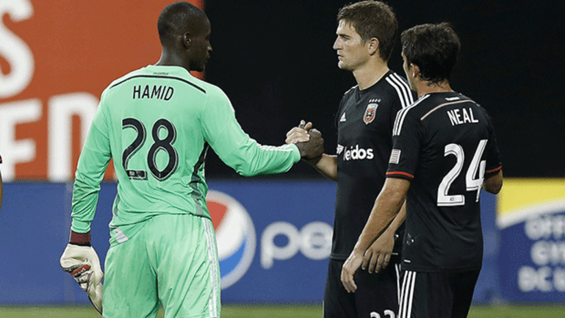 Bobby Boswell and Bill Hamid fist bump with Lewis Neal