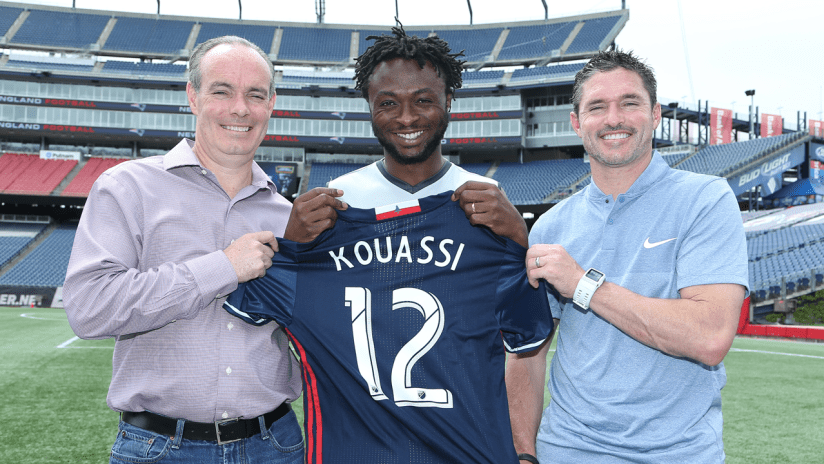 Xavier Kouassi with Mike Burns and Jay Heaps
