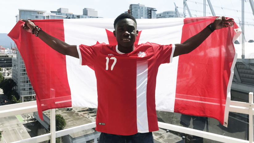 Davies with Canada flag