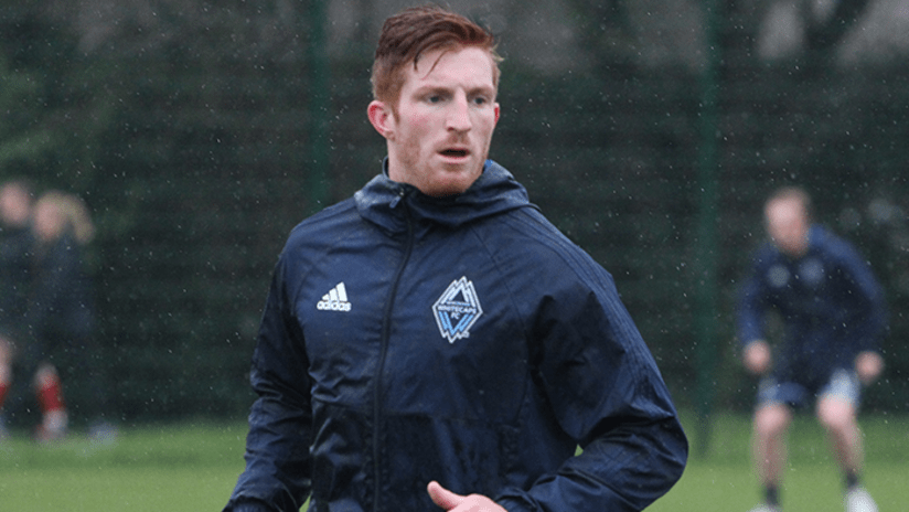 Tim Parker training in rain with jacket