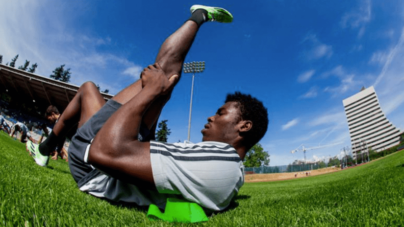 Sam Adekugbe stretching in training - Swangard - 2015