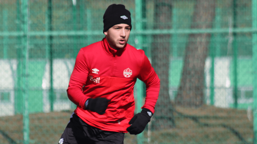 Bustos with Canada - training with a toque
