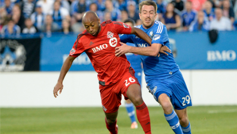 Collen Warner (Toronto FC) and Eric Alexander (Montreal Impact) in action in the 2015 ACC semifinals first leg