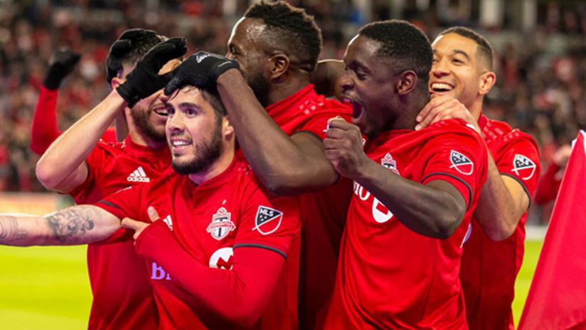Alejandro Pozuelo celebrates with teammates - Toronto FC - March 29, 2019