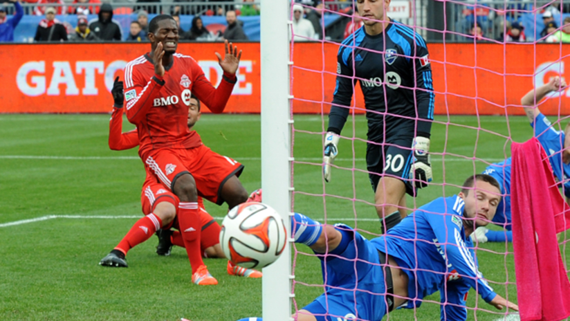 Toronto FC defender Doneil Henry cringes as he hist goes wide against the Impact