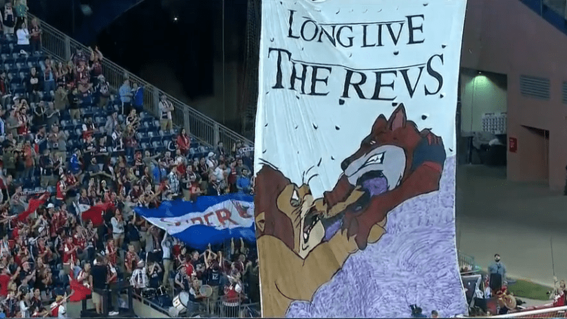 New England Revolution fans lift a tifo mocking Orlando City