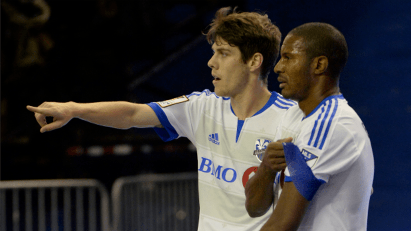 Maxim Tissot (Montreal Impact) points at something while standing next to Patrice Bernier