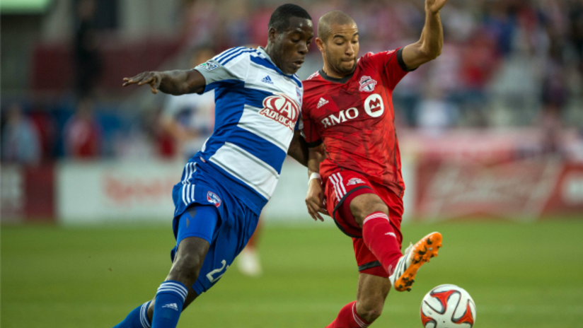 FC Dallas' Je-Vaugn Watson battles Toronto FC's Justin Morrow