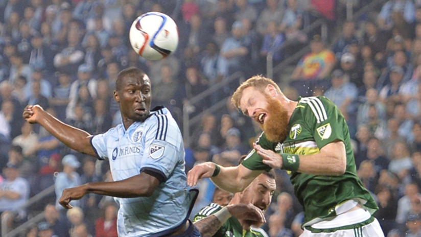 Portland Timbers defender Nat Borchers and SKC defender Ike Opara sky for a ball