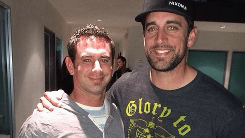 Green Bay Packers' Aaron Rodgers wearing a Columbus Crew shirt
