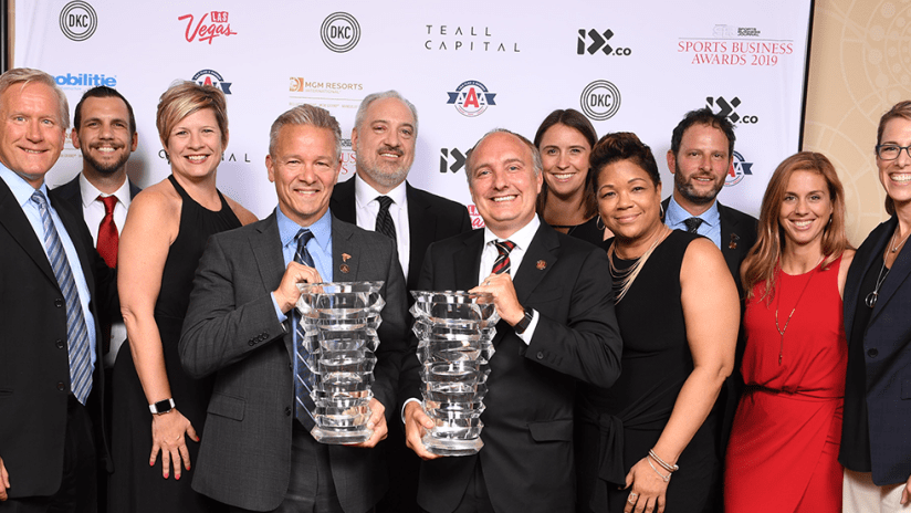 Atlanta United - front-office staff - with trophy at SportsBusiness Journal awards - 2019