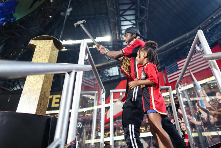 6lack hits the golden spike during the match against Orlando City at Mercedes-Benz Stadium in Atlanta, GA on Saturday, July 15, 2023. (Photo by Chamberlain Smith/Atlanta United)