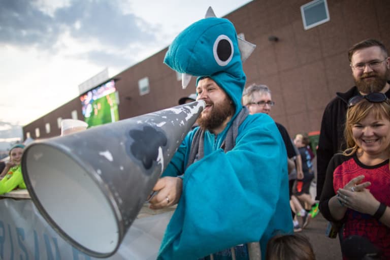 MLS made in Minnesota: Past, present & future of soccer in the Twin Cities - MNUFC fan with megaphone dressed in a Loch Ness Monster Costume.